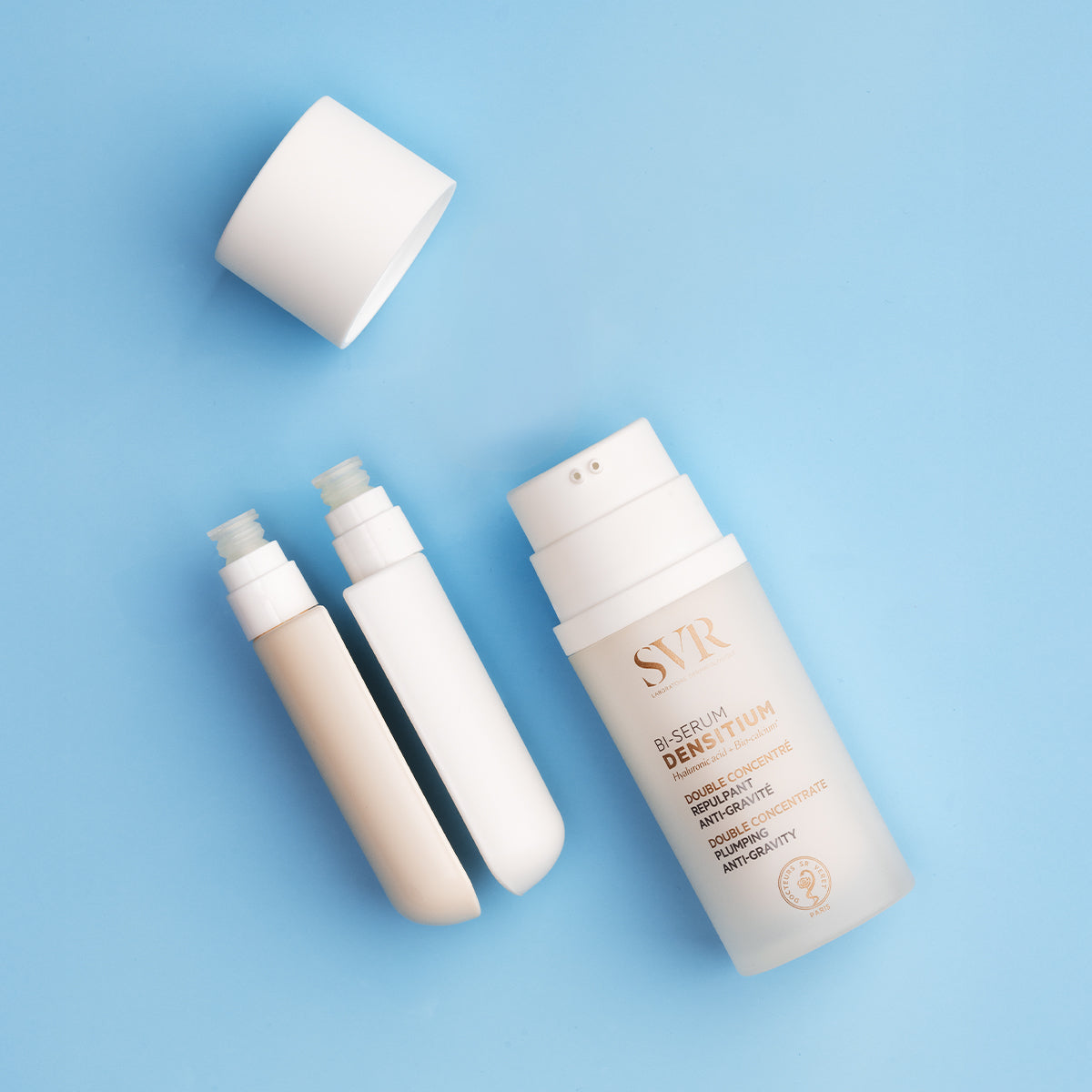 SVR Densitium Bi-Sérum anti-gravity face serum bottle with two internal chambers on a light blue background.