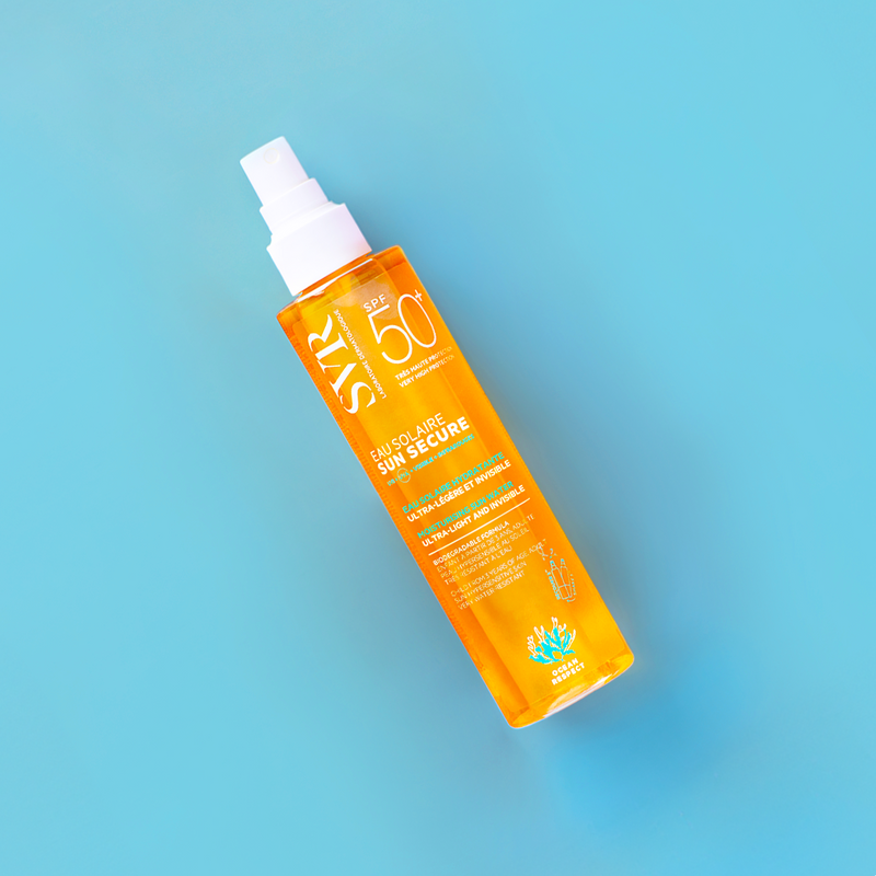 SVR Sun Secure SPF 50+ solar water spray bottle on a bright blue background.