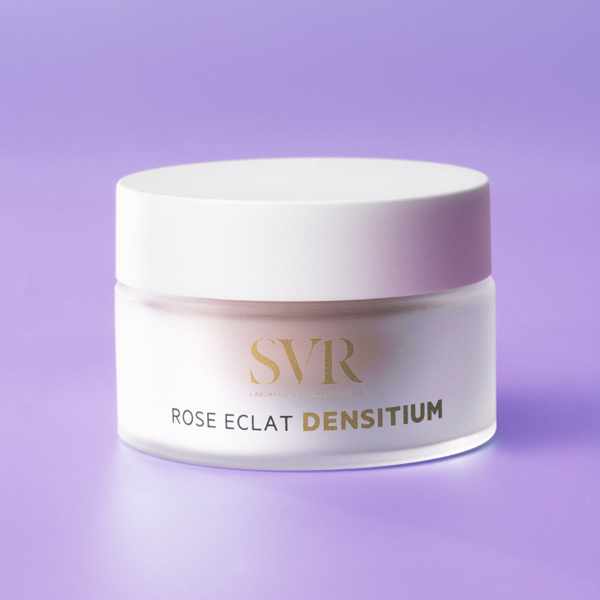 SVR Densitium Rose Eclat cream in a frosted glass jar with a white lid against a soft purple background.